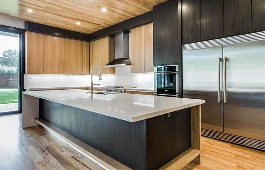 Kitchen with slab door cabinets and solid surface countertops