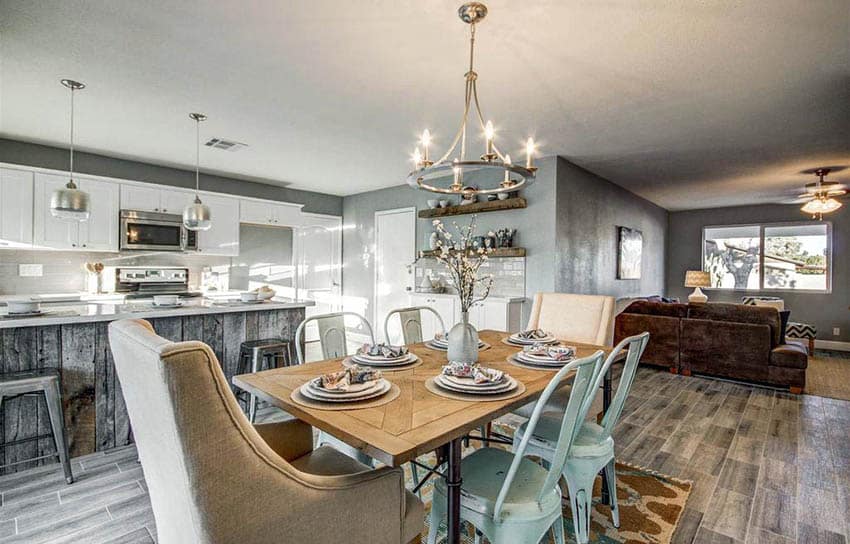 Rustic transitional room with hoop type chandelier and chrome kitchen island lights