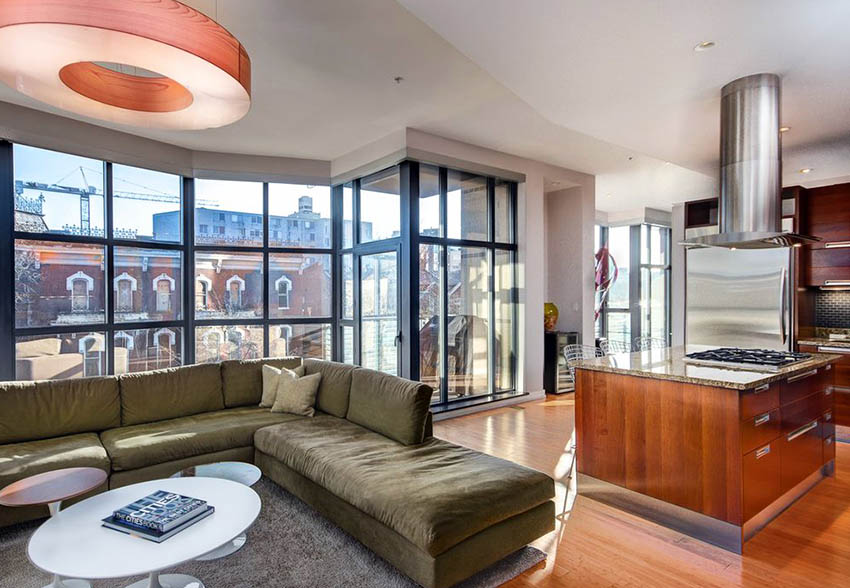 kitchen with hood over island and wrap around windows