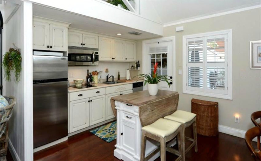 Small kitchen with portable island with folding wood top