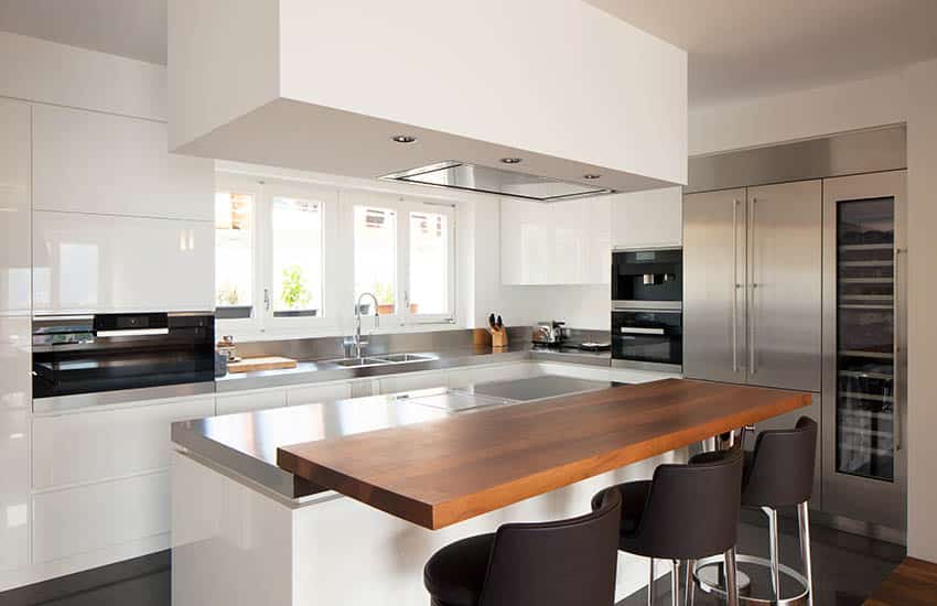 Small modern white kitchen design with butcher block countertop