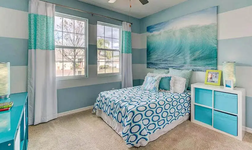 Bedroom with blue and white striped painted walls