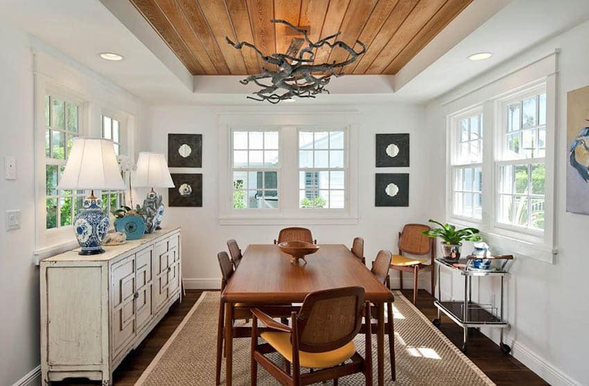 Cottage dining room with wood plank tray ceiling