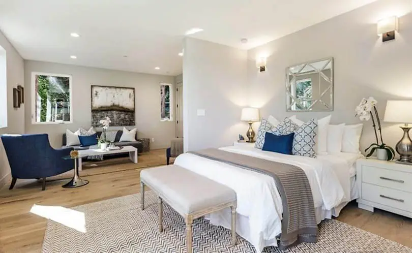 Contemporary living room bedroom combo with light wood floors