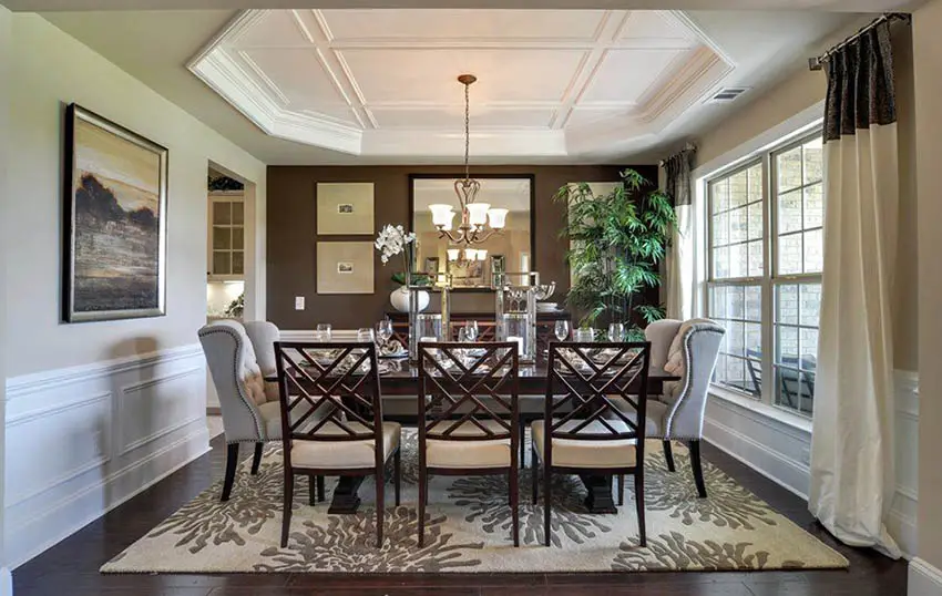 Dining room with octagonal sided tray ceiling with coffered edge design