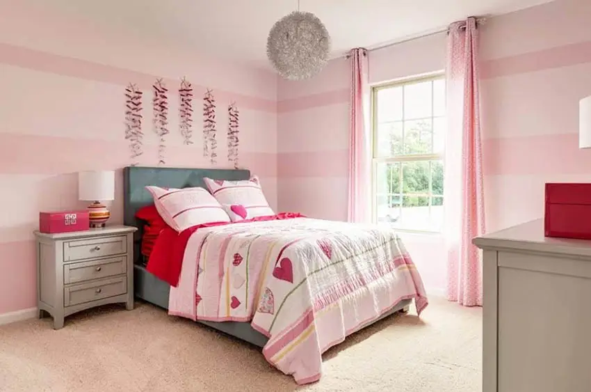 Girls bedroom with pink striped paint pattern