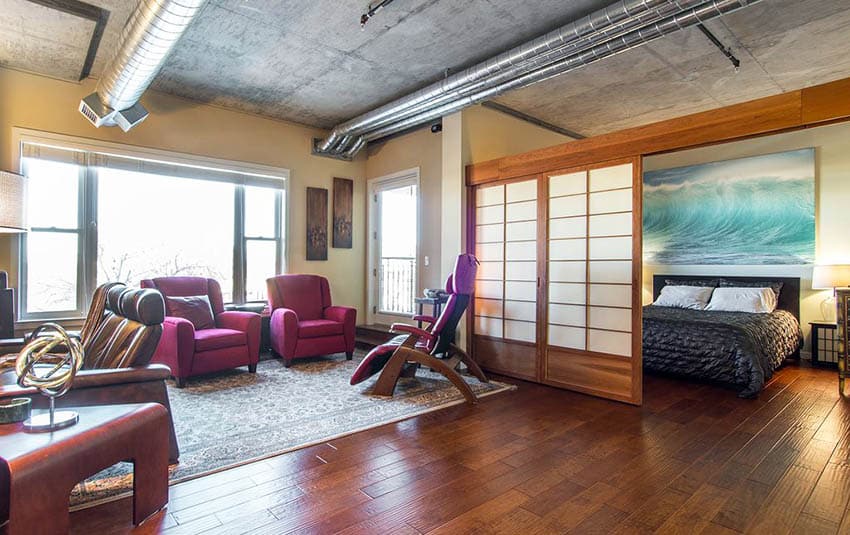 Japanese style living room and bedroom combo behind shoji doors with bamboo flooring