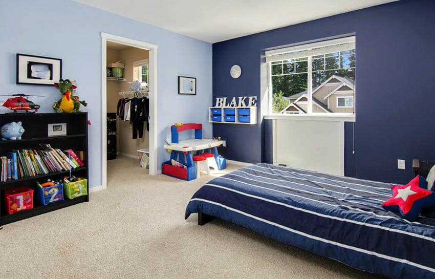 Kids bedroom with powdered blue walls, grey carpet and windows