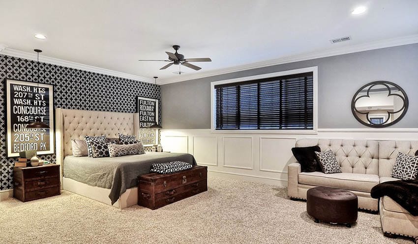 Living room bedroom combo with gray paint beige carpet and tufted platform bed