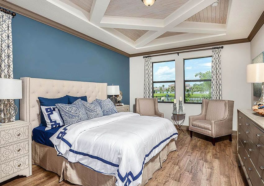 Master bedroom with off white paint and blue accent wall