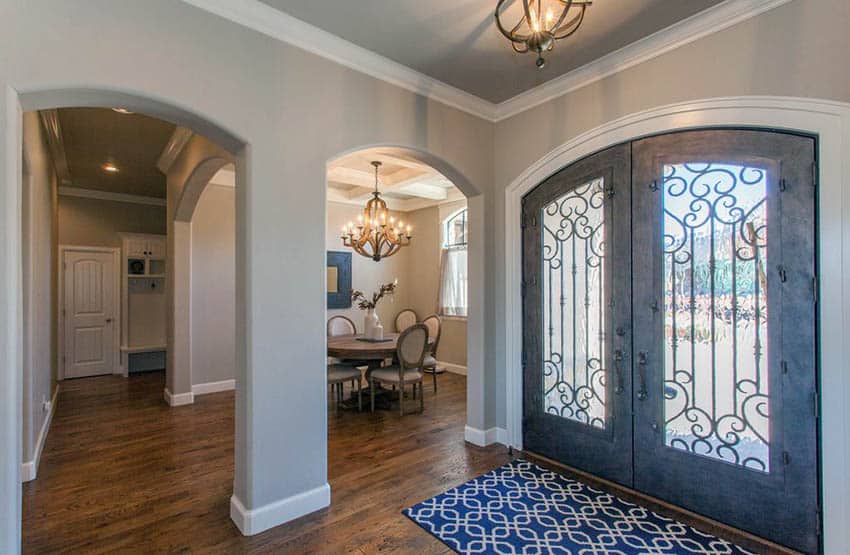 Mediterranean entryway with griege paint and dark wood floors