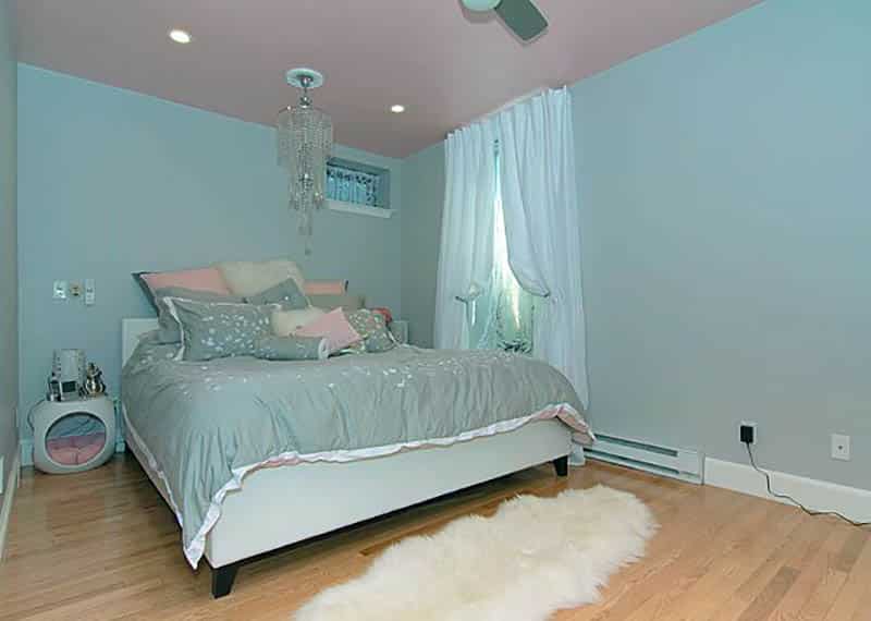 Light blue themed room with pink ceiling and blue curtains