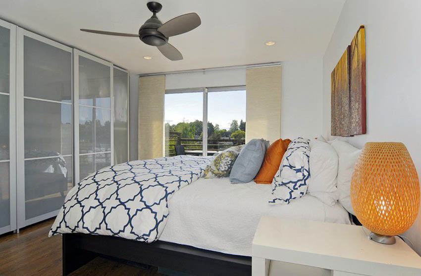 Bedroom with slider doors with frosted panels