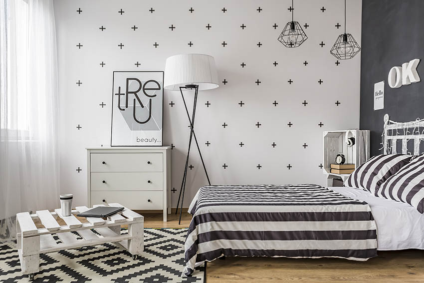 Black and white bedroom with decorative chalkboard wall