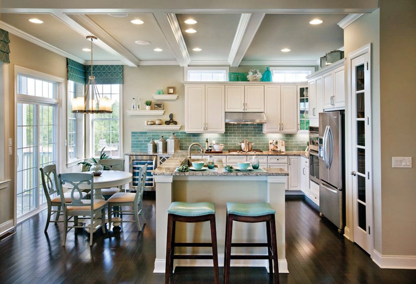 Coastal kitchen with decor and vase above cabinets and floating shelves