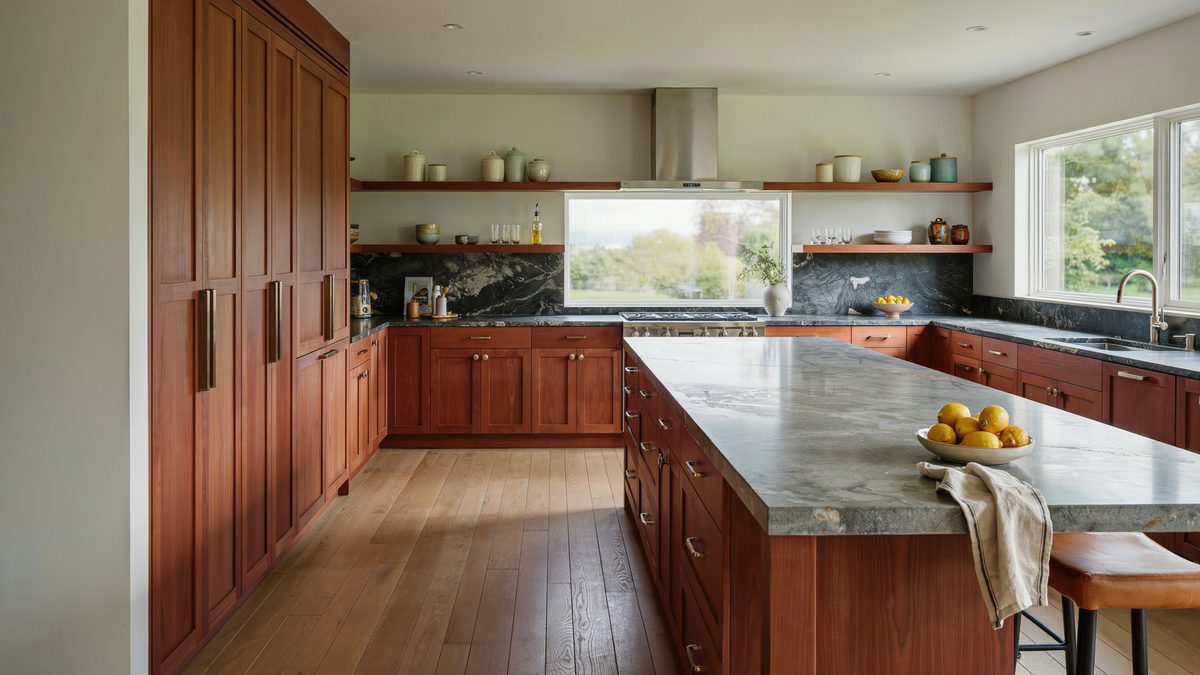 Cherry kitchen with dark honed granite counters floor to ceiling pantry and long island