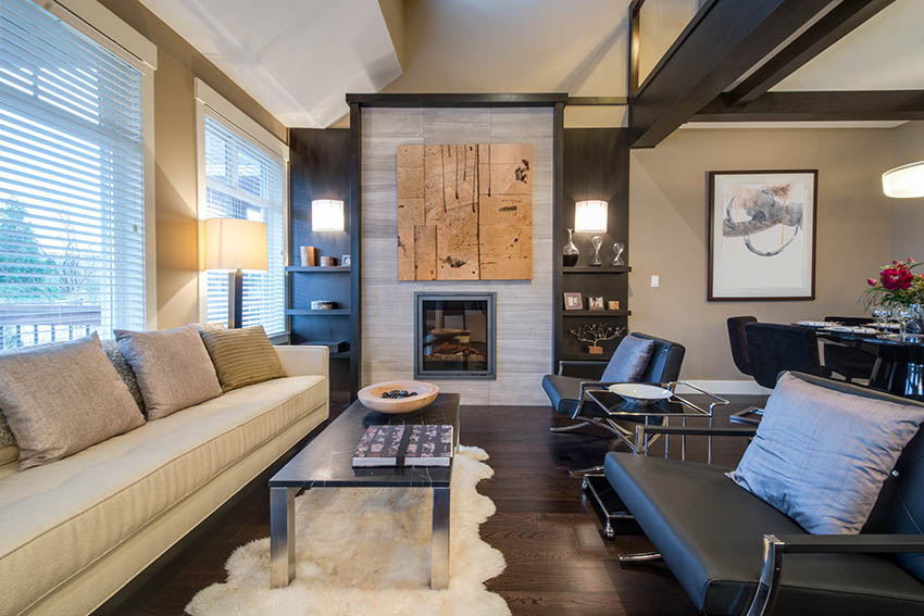 Room with porcelain tile fireplace and built-in shelves