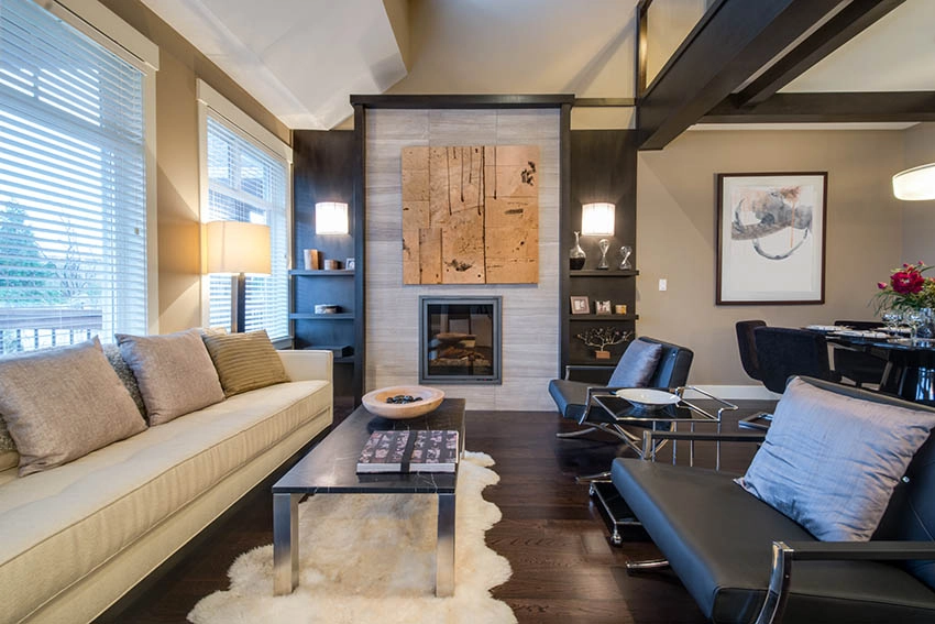 Contemporary living room with porcelain tile fireplace and built in book shelves