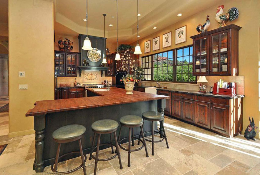 Country kitchen with rooster decor above cabinets