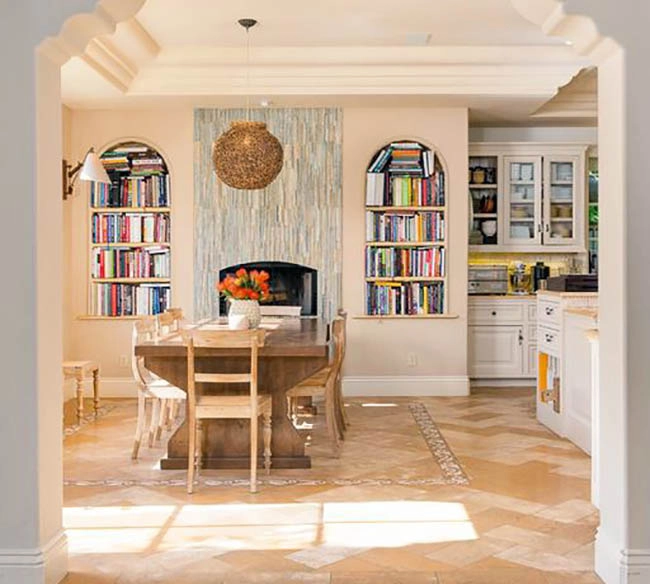 Dining room with tile accent wall and built in book shelving