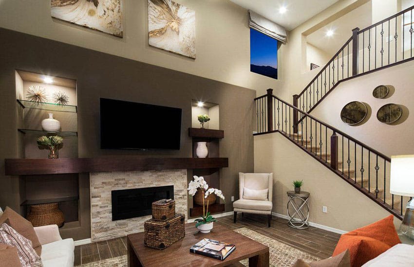 Earth tone living room with brown wall paint and stacked stone fireplace