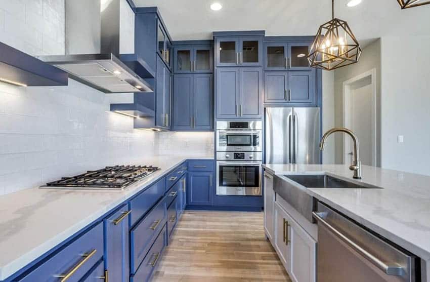 Blue and white cabinetry and offwhite quartz countertops