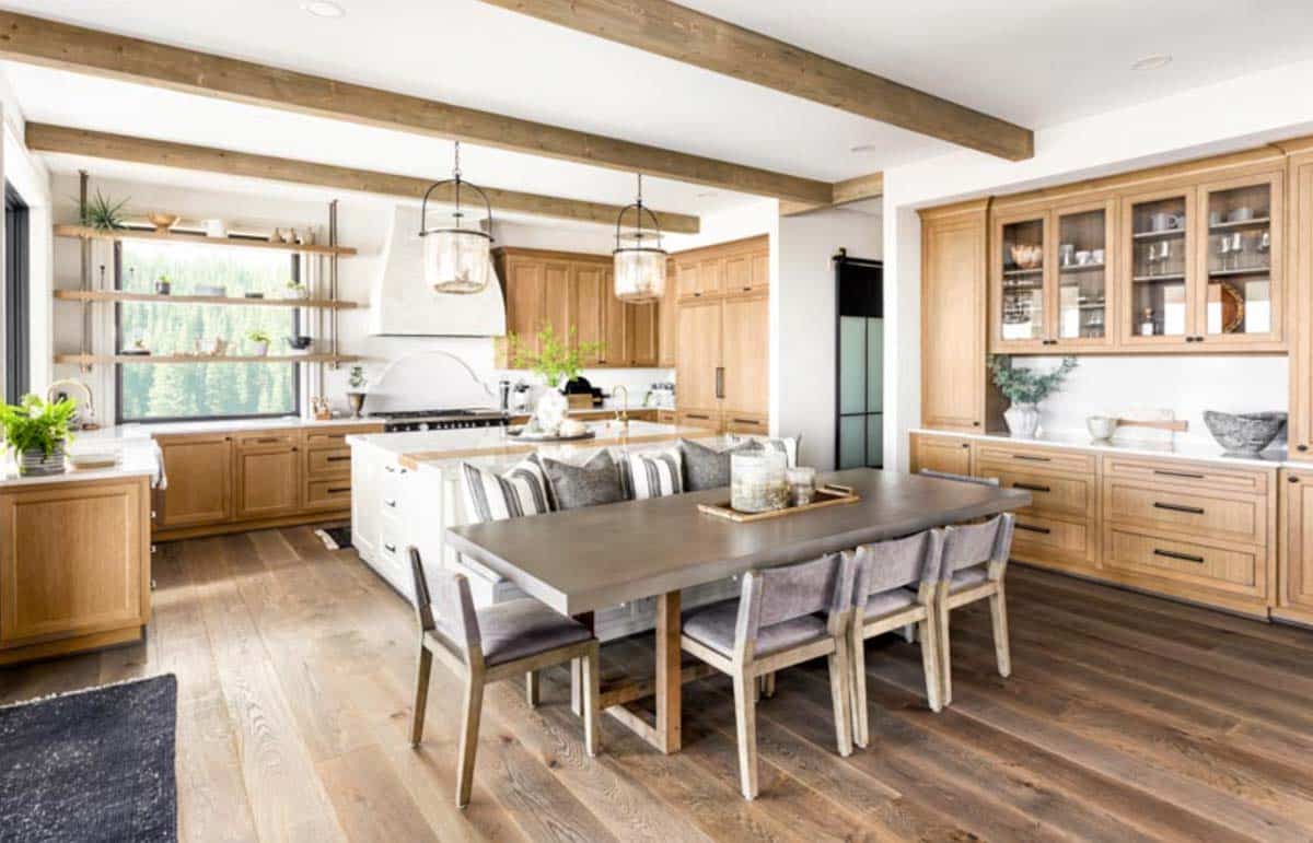 kitchen with maple cabinets exposed ceiling beams wood floors dining nook and table