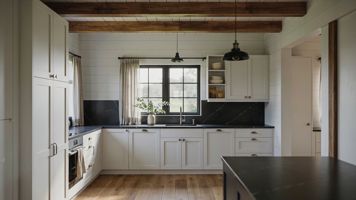 White paneled walls with black quartz counters and a matching dark island