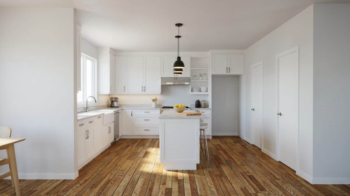Modern white shaker kitchen with honey toned cork plank flooring and pendant light