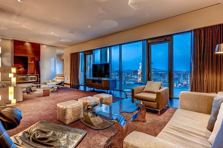 Modern living room with tan walls and brown curtains