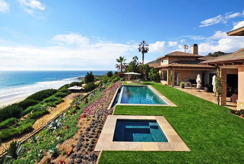 Oceanfront swimming pool with stone tile