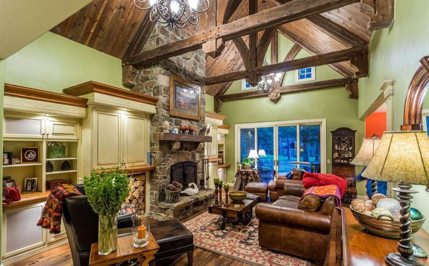 Rustic living room with green wall paint and vaulted ceiling