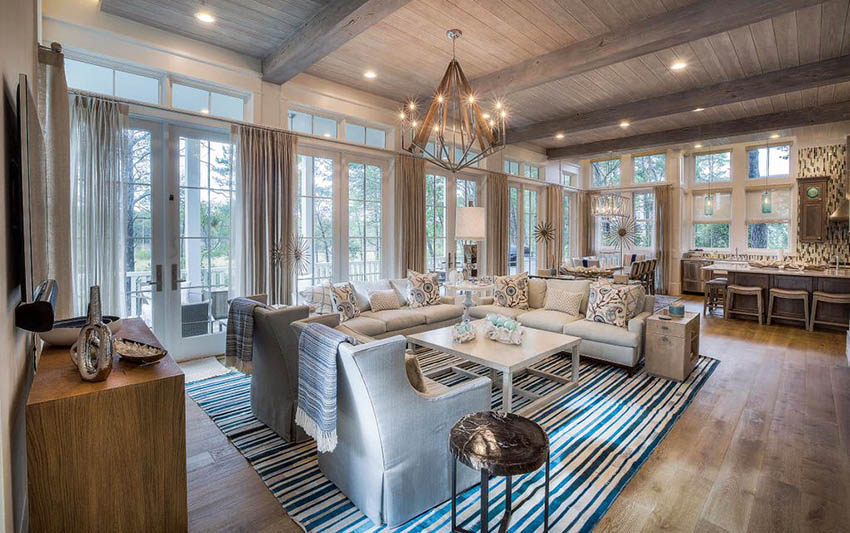 Rustic living room with hardwood floors and wood plank ceiling and wraparound windows