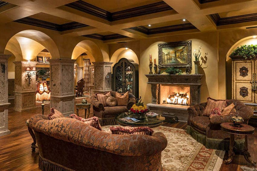 Rustic Mediterranean style room with arched walls and fireplace