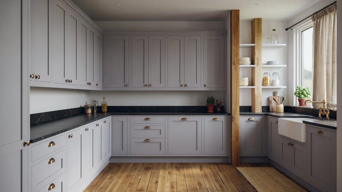 Soft gray violet cabinets wrapping a corner with black stone counters and apron sink