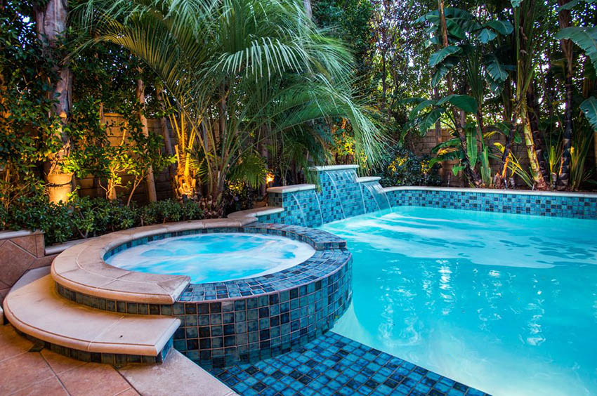 Pool with ceramic tile, dipping area and palm trees