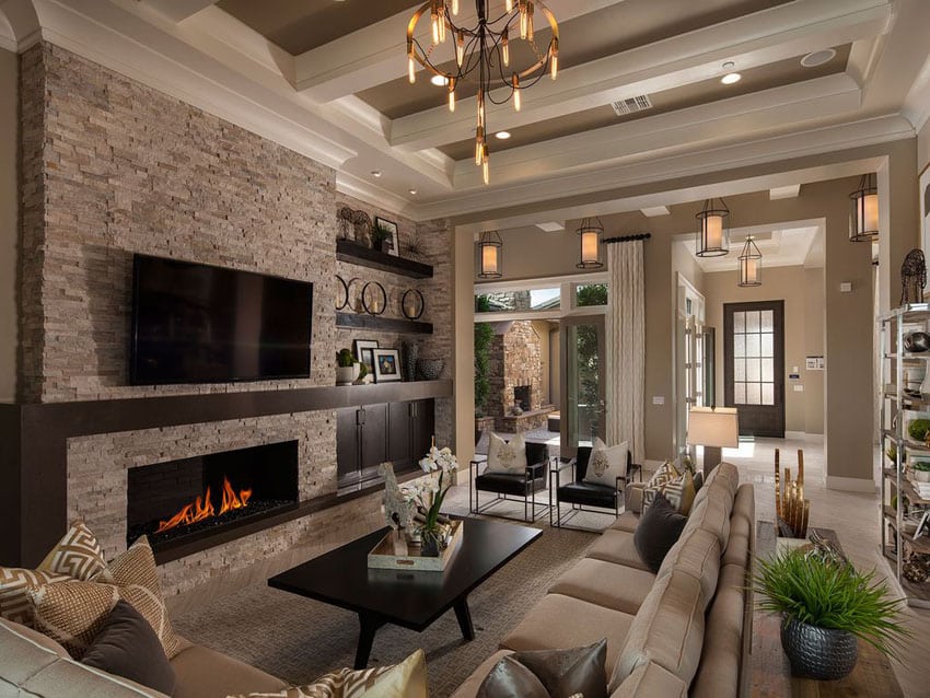 Traditional room with shades of ivory and soft gray, stone fireplace and high ceilings