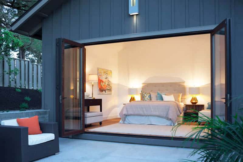 Bedroom with folding accordion doors for indoor outdoor living