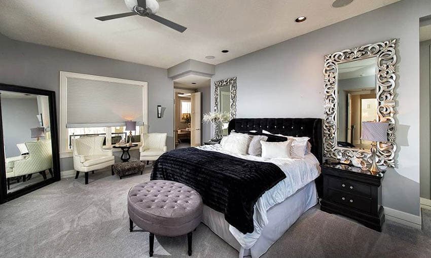 Bedroom with large corner mirror