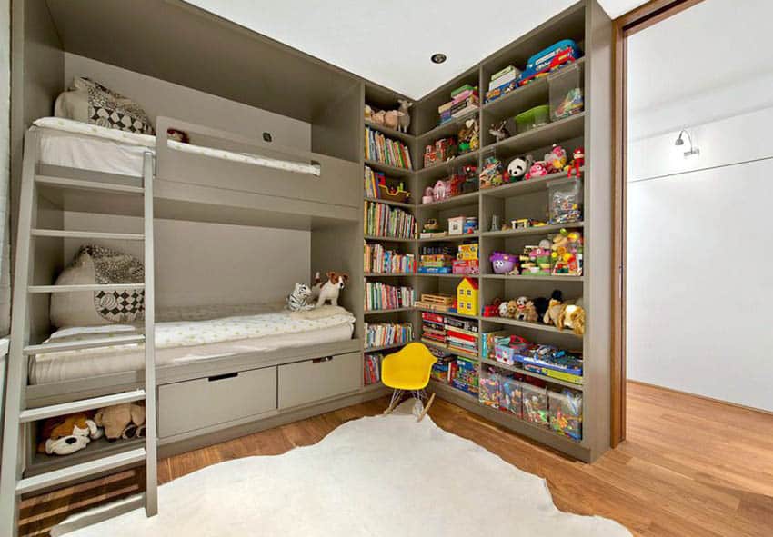 Kids shared bedroom with bunk beds and built in toy storage