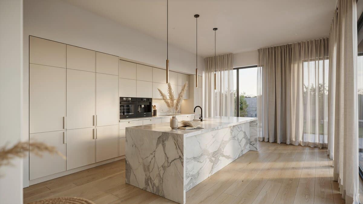 Carrara marble waterfall countertop wraps a long island beneath slim pendant lights