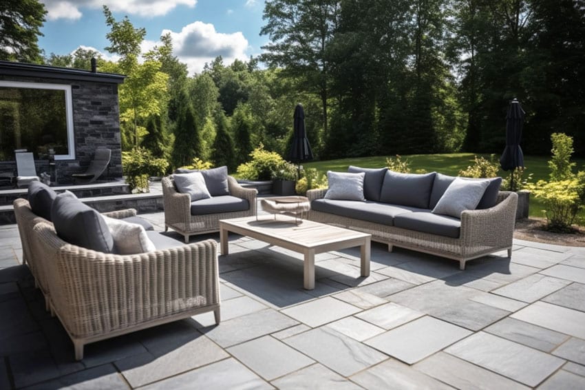 Modern stone patio gray with sandstone pavers and outdoor furniture