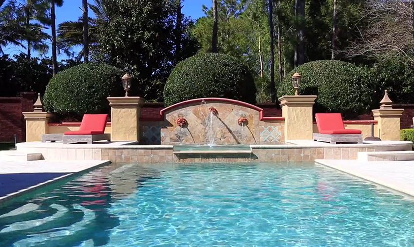 Rectangular swimming pool with roman style waterfalls