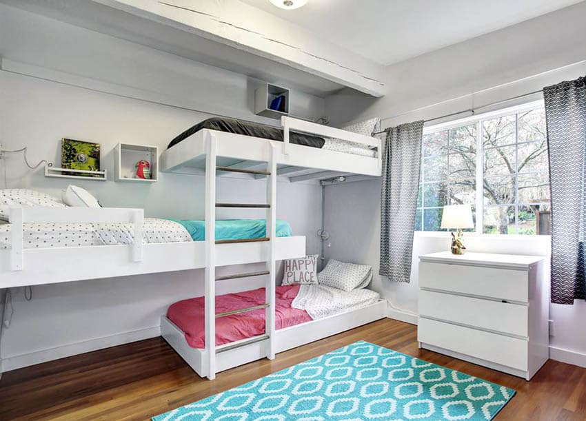 Shared kids bedroom with built in bunk beds and colorful bedding