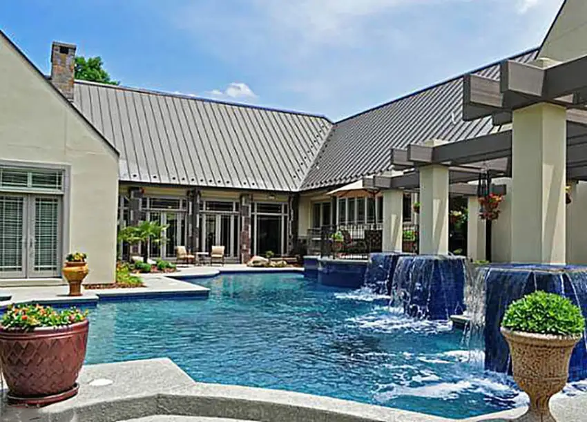 Irregular shaped pool with blue pedestals