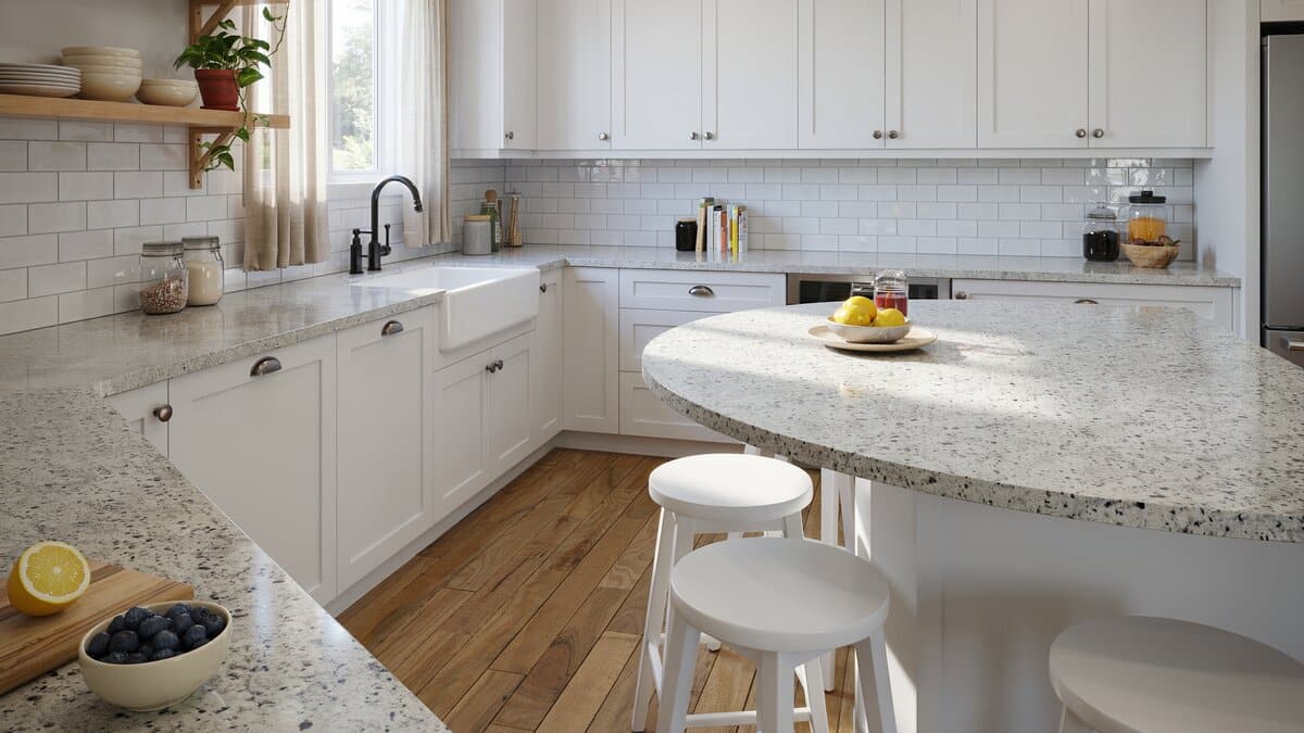 Country kitchen with black and white granite rounded island and farmhouse sink