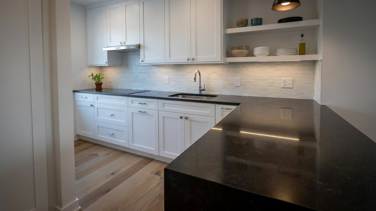 Modern white kitchen with honed matte Absolute Black granite countertops