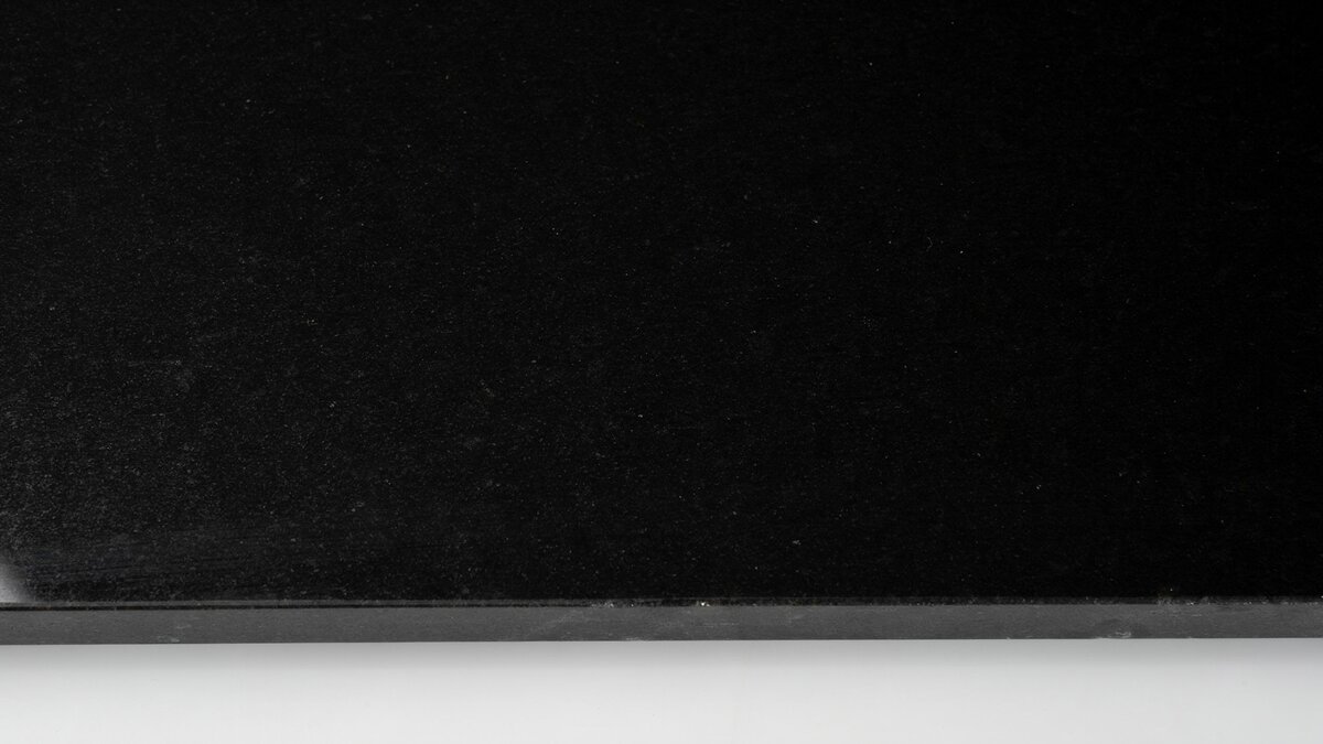 Polished Absolute Black granite slab with solid jet black fine grain surface