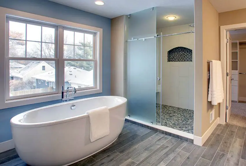 Bathroom with sliding door and mosaic tile 