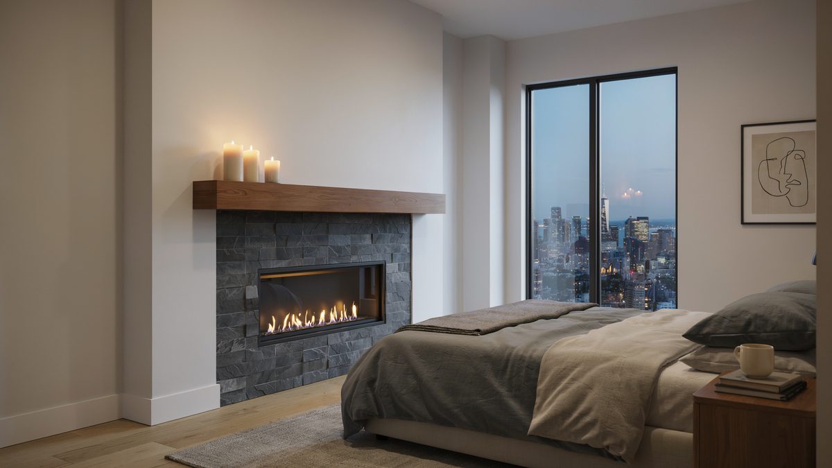 Stacked slate fireplace with a chunky wood mantel and candles above a city skyline